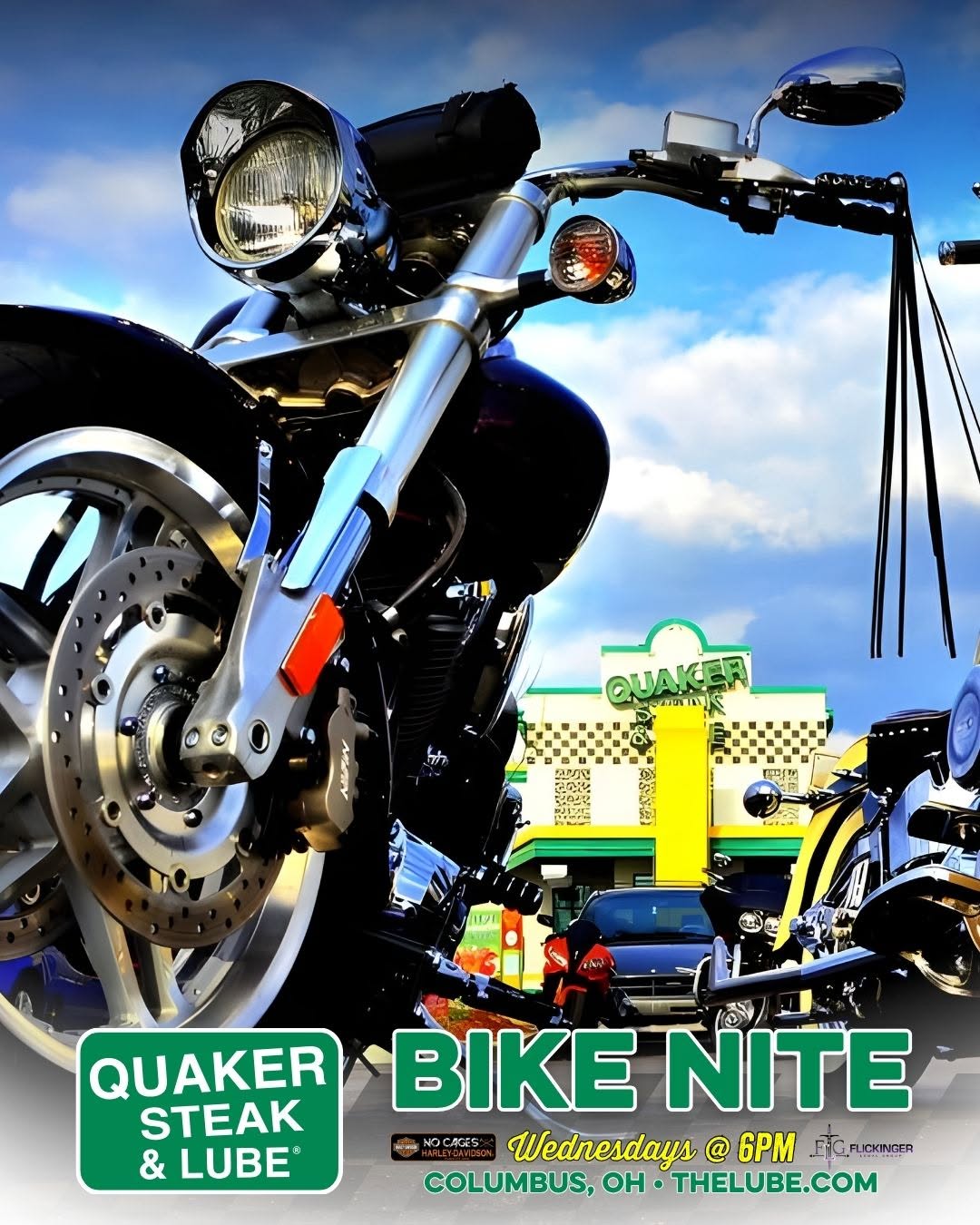 Close-up, low-angle view of a shiny black motorcycle with a Quaker Steak & Lube Bike Nite poster and venue in Columbus, Ohio in the background.